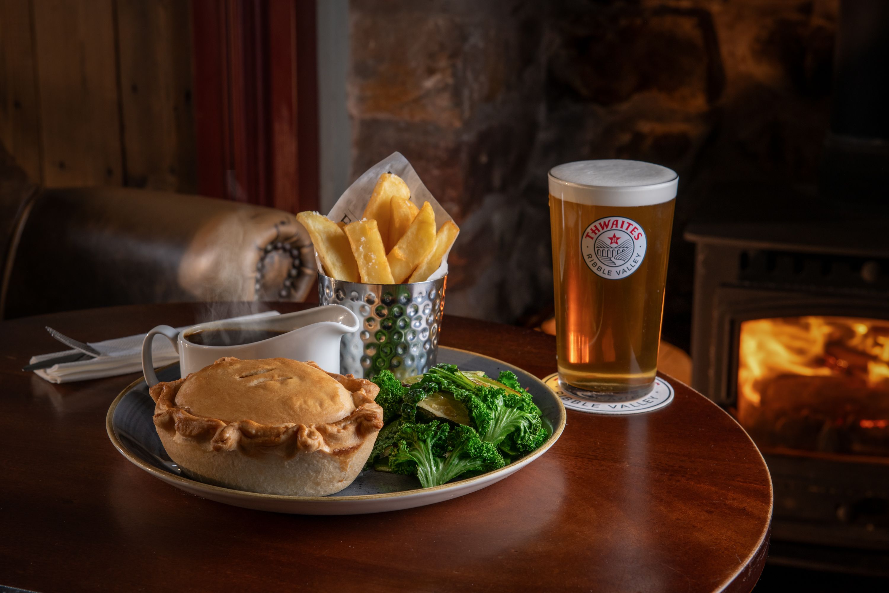 pie and pint in front of a fire in heysham