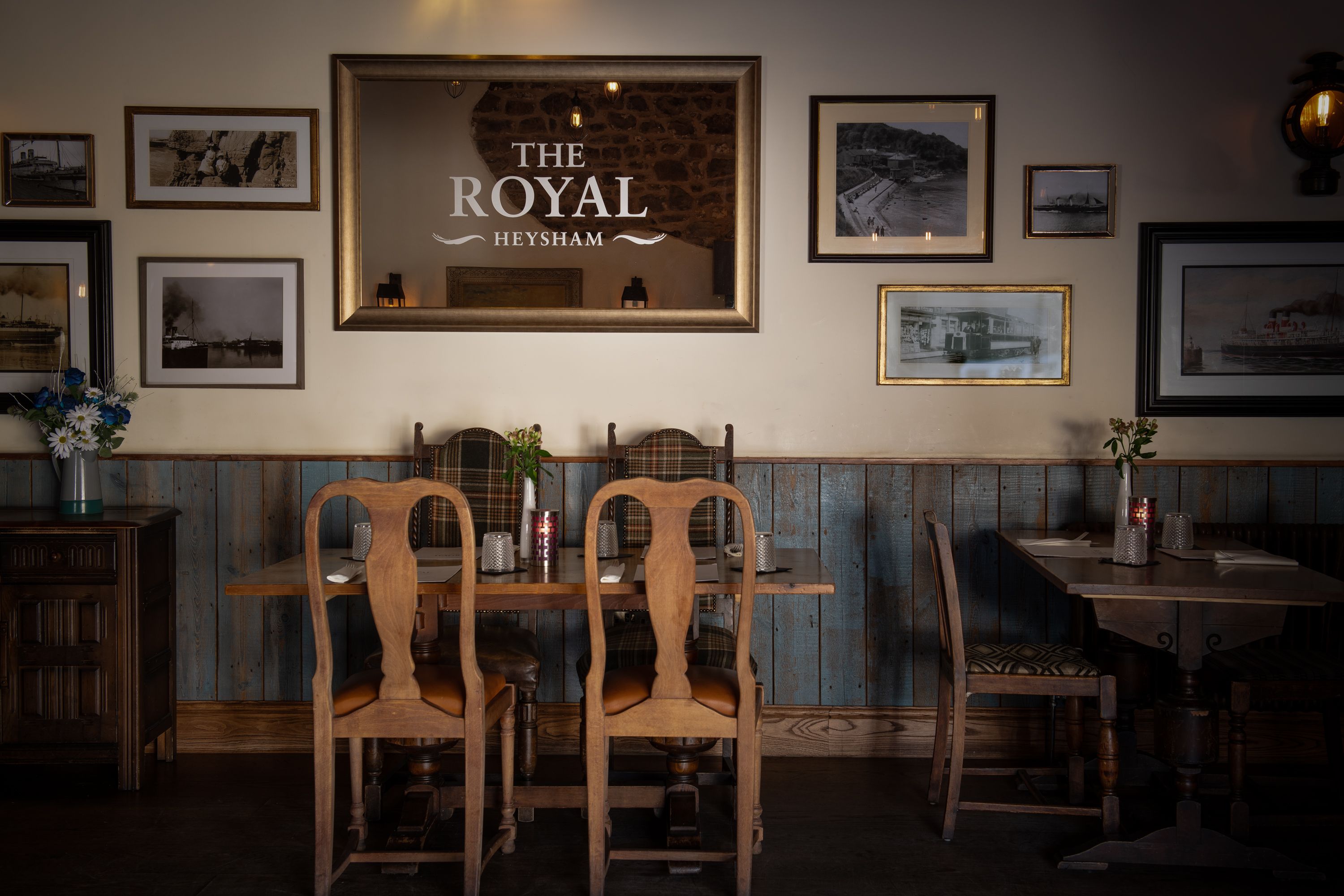 a restaurant corner with wooden furniture